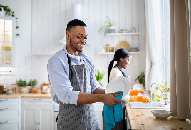 Man and Woman Washing Dishes for Spring Cleaning