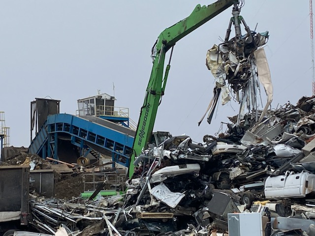 crane picking up metal