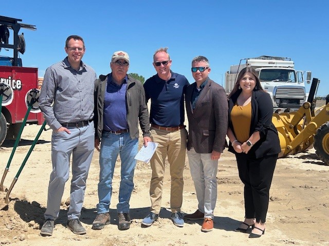 group of 5 bankers at construction site